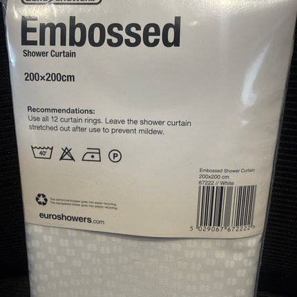 Packaged Euro Showers 'Embossed' shower curtain, showing the white back panel with specifications, barcode, and care instructions over a dark textured background.