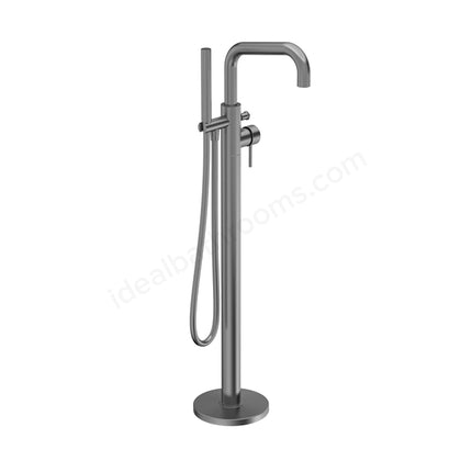 A modern matte dark gray freestanding bathtub faucet with a curved gooseneck spout, a vertical base, and an attached handheld shower hose, shown on a plain white background.
