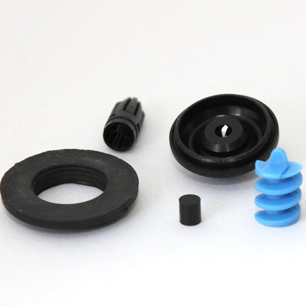 A set of black and blue plastic and rubber replacement parts, including a large black ring, a black collar, a small black cap, and a blue spiral spring, arranged on a white background.