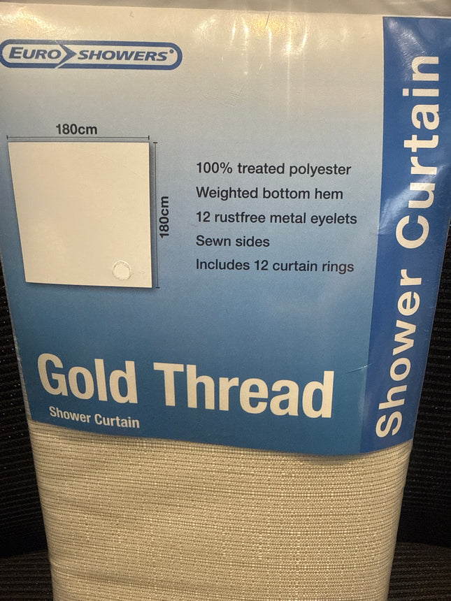 Euro Showers Gold Thread shower curtain packaged with a blue and white label, showing the beige woven curtain material rolled up on a dark textured surface.