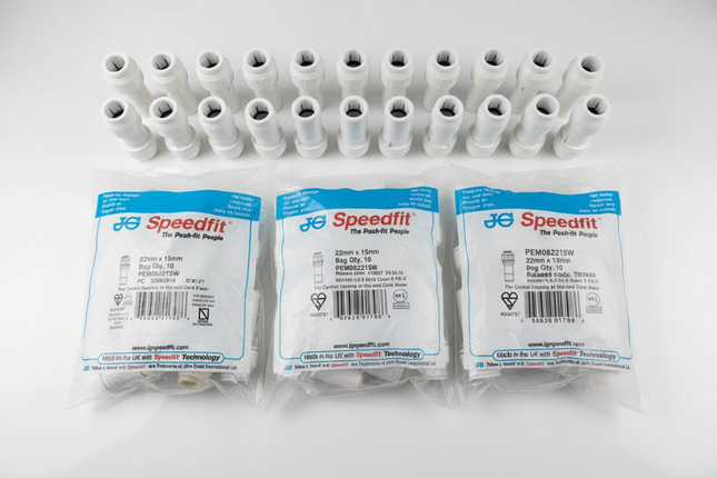 Plastic connectors with Speedfit packaging on a white surface