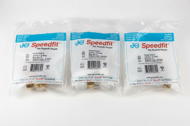 Three packages of Speedfit plumbing parts on a white surface.