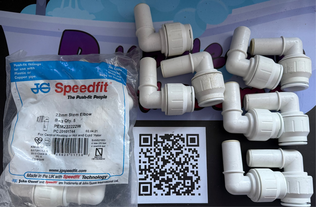 Plumbing fittings with Speedfit packaging on a white background