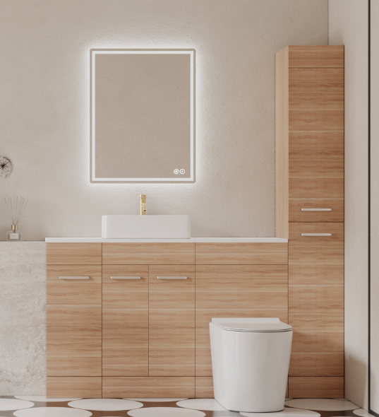 A modern bathroom vanity setup with a white rectangular sink, gold faucet, illuminated square mirror, light wood cabinet, a tall matching storage tower, and a white toilet in a clean interior.